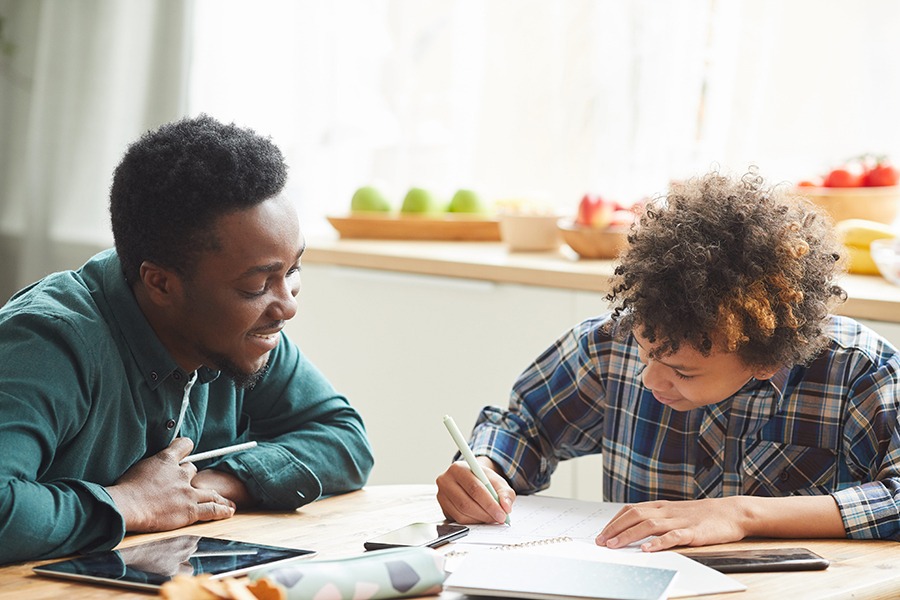 Father and Son studying at home